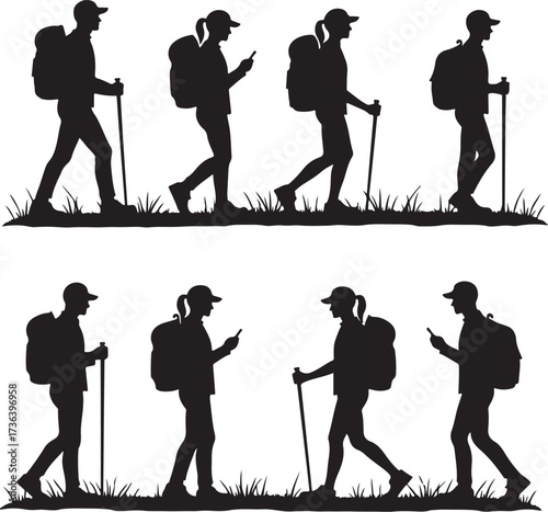 Silhouette hikers with backpacks and walking sticks on grass