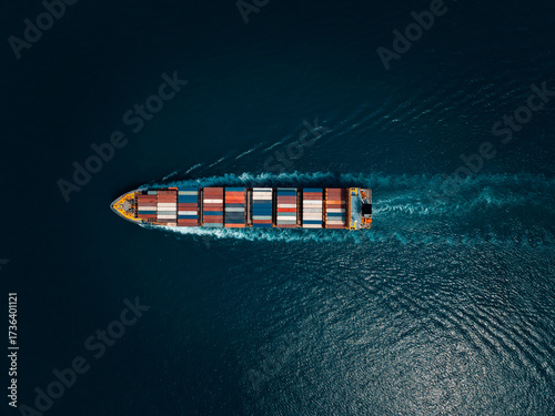 photograph of large container ship sailing on a deep sea, fully loaded with multi-colored containers, reflecting global maritime transport and logistics, cinematic dark tone  process.