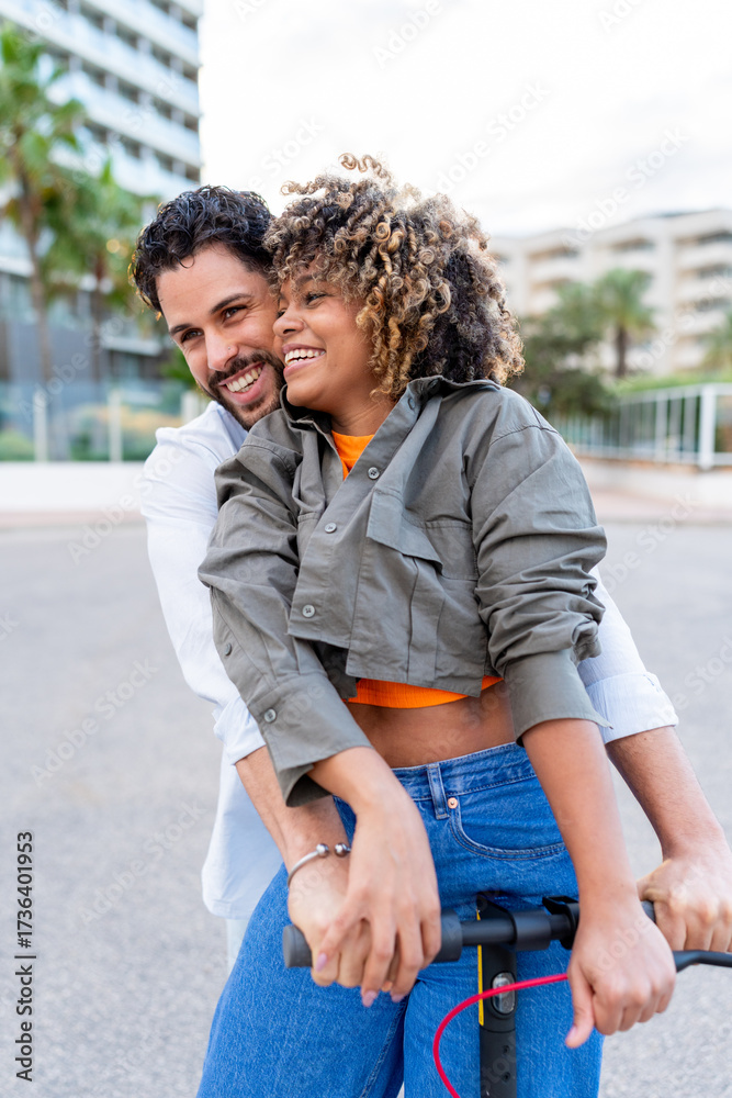 Fototapeta premium Happy couple embracing, riding electric scooter in city