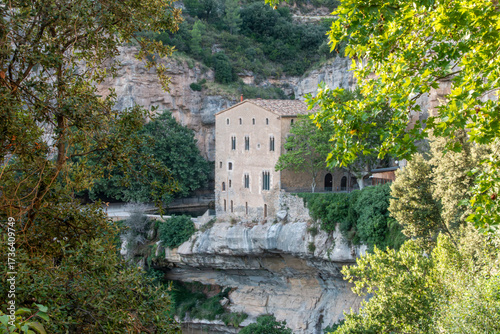 Gothic Architecture Priory House Sant Miquel del Fai Monastery Barcelona Spain 15th Century Stone Building on Cliff and Lush Greenery