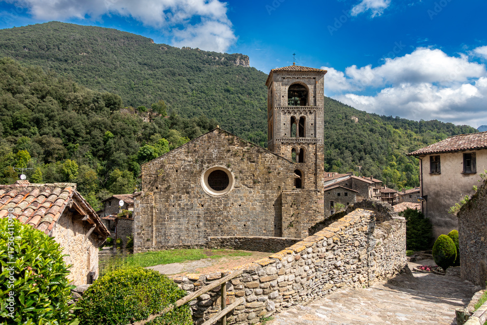 Fototapeta premium The 12th-century Romanesque church of San Cristóbal nestled in the mountain village of Beget, Catalonia, Spain.