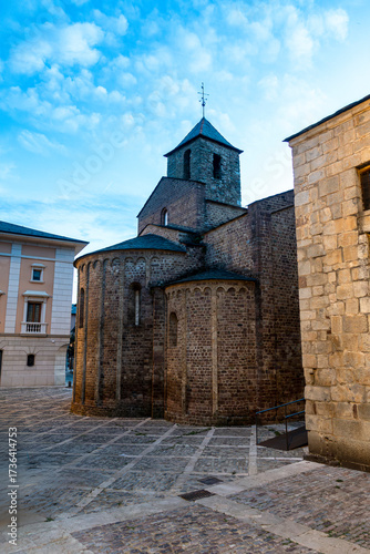 The ancient Romanesque apse of the Church of Sant Miquel in the cathedral complex of La Seu d'Urgell, pictured at twilight in the Catalan Pyrenees