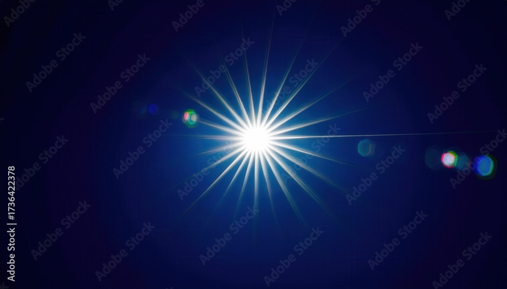 Obraz premium bright starburst light flare against deep blue night sky with radiant beams and lens glow creating cosmic abstract ethereal background ideal for expansive editorial banner or digital wallpaper