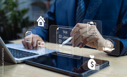Businessman filing corporate and individual income tax return on tablet, concept of tax payment, VAT filing, property tax and financial compliance management.