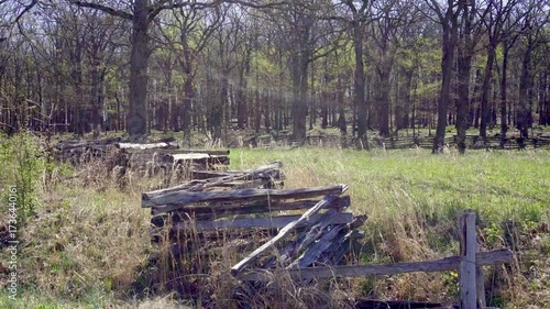 Pea Ridge, Arkansas: Pea Ridge National Military Park, battlefield of US Civil War Battle of Pea Ridge. Split rail fence with tall grass and treeline.