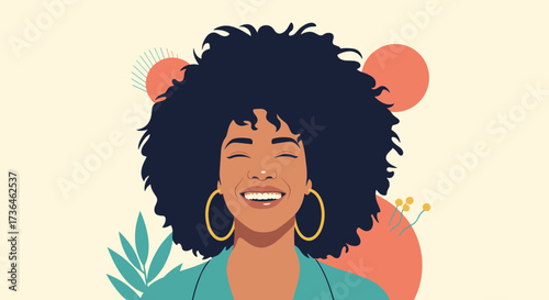 A joyful woman with a large afro smiles widely wearing hoop earrings and a teal blazer.