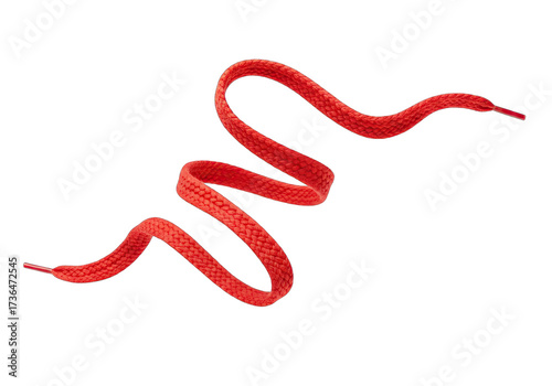 Vibrant red shoelace weaving a captivating dance against a stark black backdrop