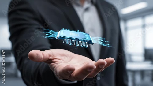Businessman Holding Futuristic Microchip - A man in a business suit presents a glowing microchip in his open hand, symbolizing technology and innovation.