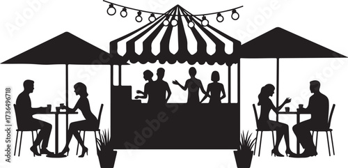 Silhouette of people at outdoor cafe with striped awning and string lights