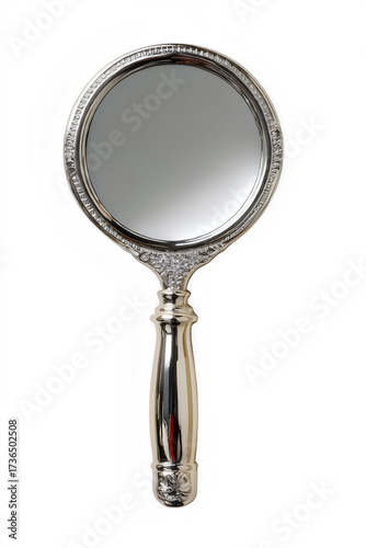 Elegant silver hand mirror on black background