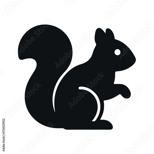 Silhouette of a squirrel with a bushy tail in profile view