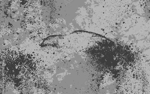 Abstract grunge texture in monochrome shades of black and gray with rough, splattered, and uneven patterns. Ink splashes, dust, or concrete stains with overlays, posters, or digital artwork