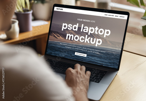 Mockup of a man behind a laptop