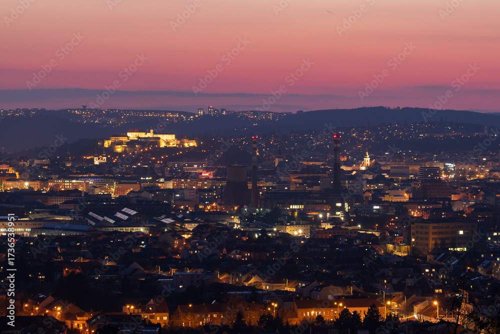 Fototapeta premium Brno, Czech Republic - March 29, 2025: View of the city from above at night. Evening city panorama. Špilberk Castle