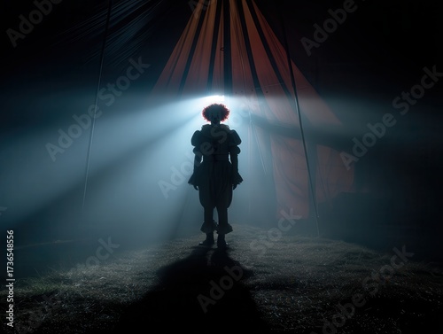 Sinister clown silhouette standing at the entrance of a dark circus tent
