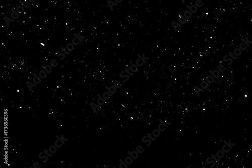 Falling Snow down On The Black Background. Blurry flecks snow overlay. White spots on black background. Abstract speckles overlay. Snowfall on black background - design element. For photo edit