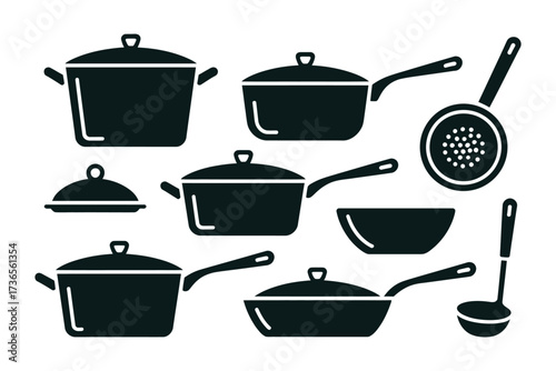 Collection of essential kitchen cookware and utensils, ready for culinary creation.