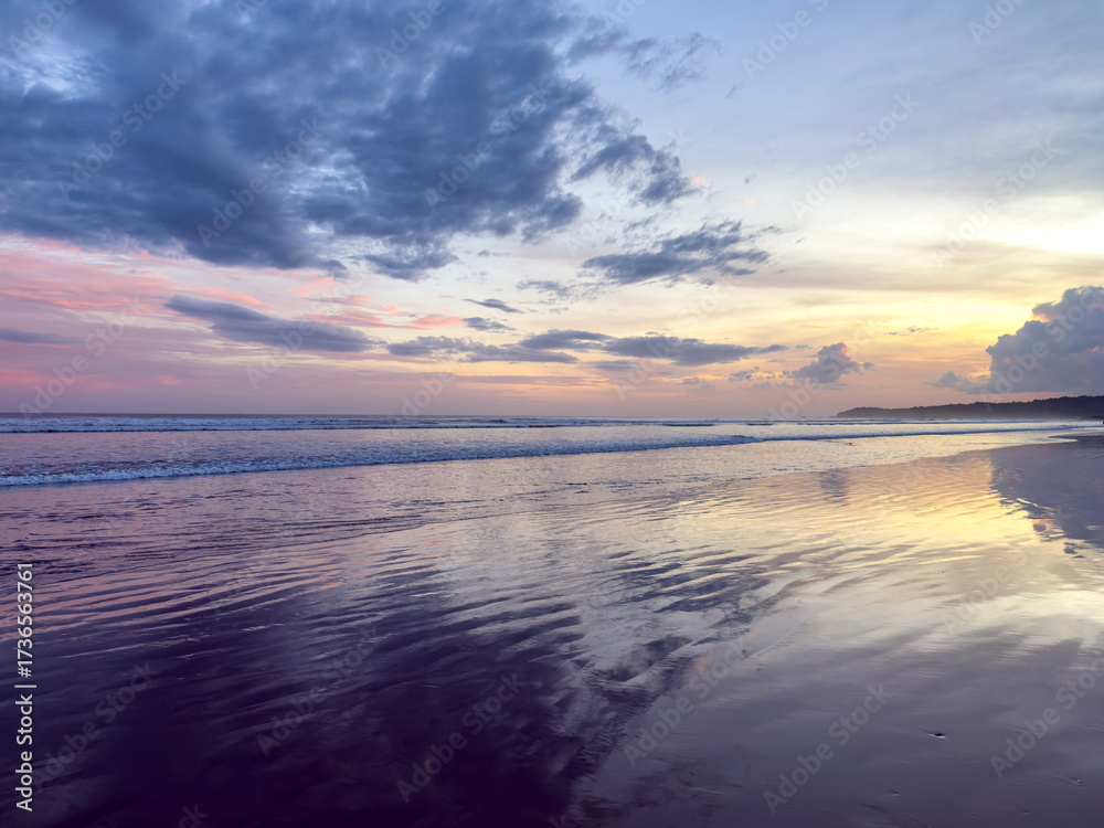 Fototapeta premium Colorful Sunset Reflections on Beach Shoreline