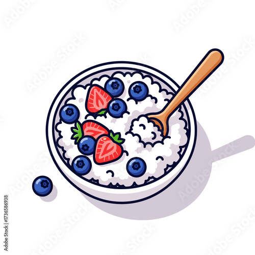 Cottage cheese breakfast with fresh strawberries and blueberries in white bowl, viewed from above. Cottage cheese breakfast makes delicious and healthy way to start your day,