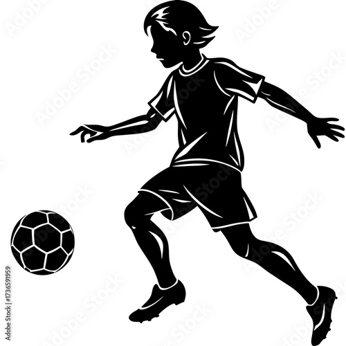 Black silhouette of a boy playing soccer football kicking