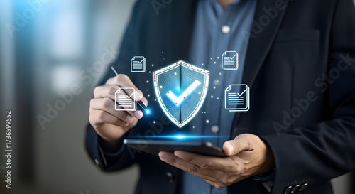 Cybersecurity and Data Protection: Businessman with Secure Shield Hologram