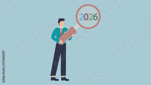 Foto A man looking through a magnifying glass at the year 2026, representing future p