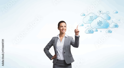Businesswoman pointing at cloud computing concept representing data synchronization