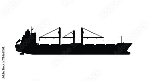Silhouette of a large cargo ship with cranes sailing on the open sea