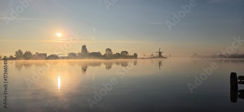 Zaanse Schans windmills at a froggy sunrise, the Netherlands