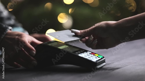 Barman Processes An Order Payment With A Credit Card On A Wireless Terminal At The Bar Counter