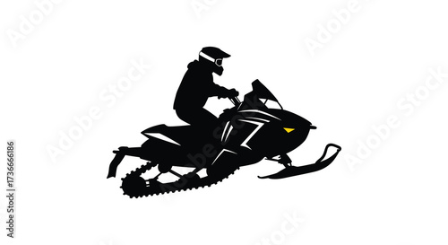 Dynamic silhouette of a snowmobiler riding a snowmobile in motion through snow