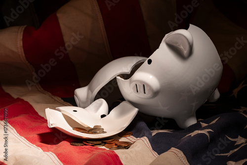 Broken Piggy Bank pieces on American Flag – Savings Concept