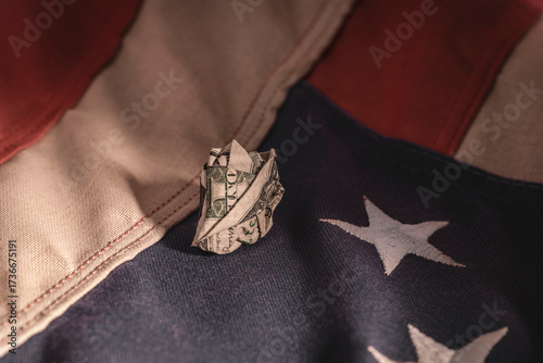 Crumpled Dollar on Flag Folds – Financial Instability Symbol