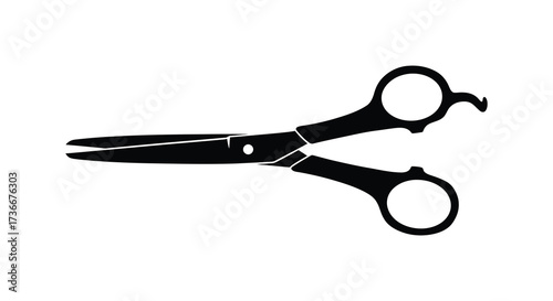 Close up silhouette of professional hairdressing scissors ready for a precise cut
