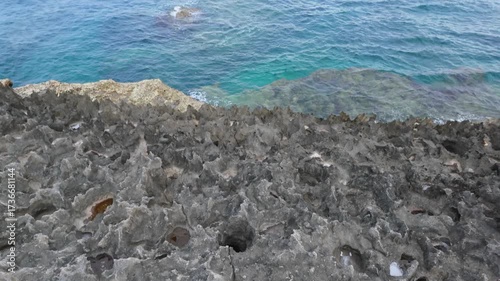 This stock video shows a reef and the sea.