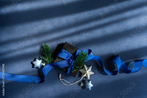 Blue Christmas gift box with festive decorations