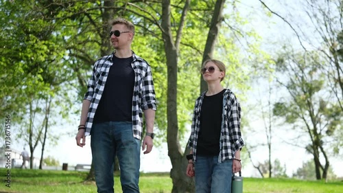 Father And Daughter Walking In Shirts Family Look Spending Time In Summer Park