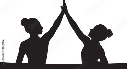 Two black silhouette figures giving a high five with buns in hair two people success