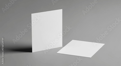 Minimalist White Business Cards on a Subtle Gray Background with Soft Shadows and Subtle Lighting Showcasing Simple Elegant Design Elements