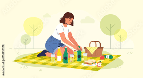 Preparing A Picnic: Woman Kneeling and Arranging Food and Drinks Outdoors with Style