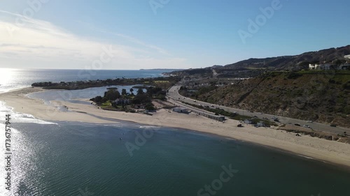 Aerial drone view of Malibu point at sunset with the Pacific Ocean