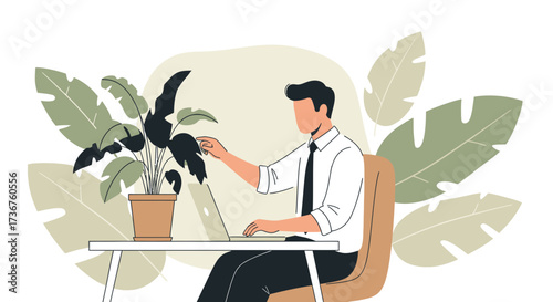 Man working on laptop while also tending to a plant in a relaxed office setting