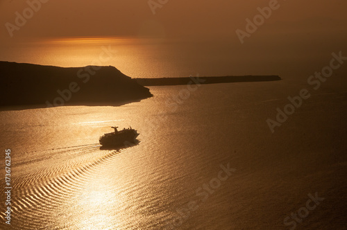 Serene Sunset Seascape with Ship and Golden Reflections