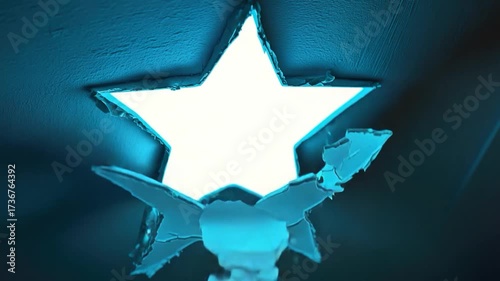 A star-shaped light hangs from the ceiling in a modern room or office