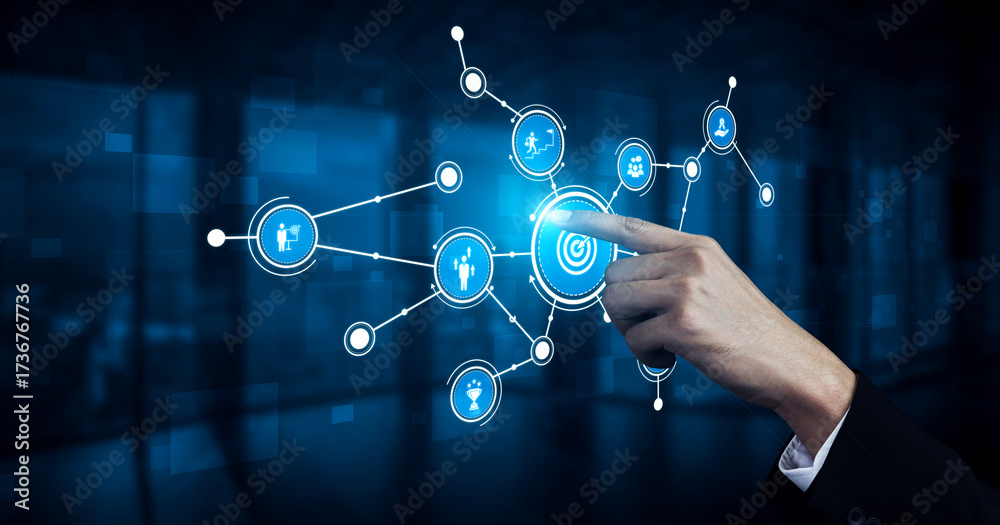 Fototapeta premium A hand interacts with a digital touchscreen, engaging with a network of icons in a blue background, symbolizing modern technology and digital connection. Tessel