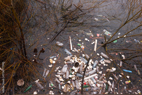 Environmental Pollution Plastic Bottles and Trash Floating in Dirty Water Ecological Crisis
