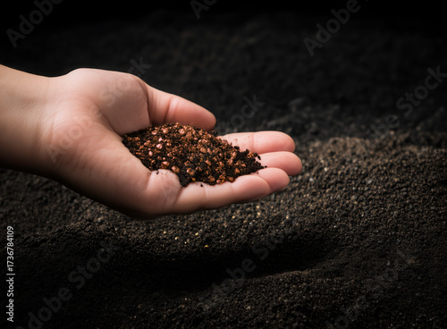 Copper mining holding copper in a hand