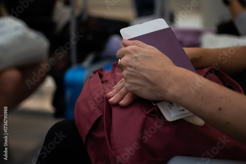 Woman holding passport and boarding pass preparing for solo travel