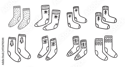Warm winter socks line art clipart set with knitted patterns and trees, monochrome collection, hand drawn.