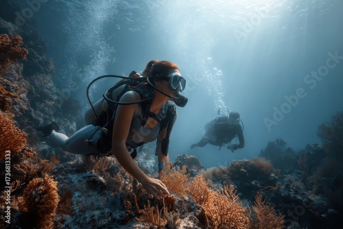 Wallpaper Mural Two scuba divers exploring vibrant coral reefs in tropical waters during a sunny day under clear blue skies Torontodigital.ca